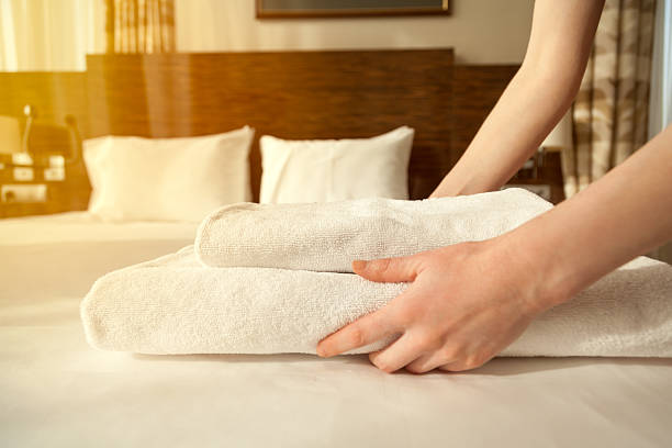 istock Maid changing towels in hotel room 524152230