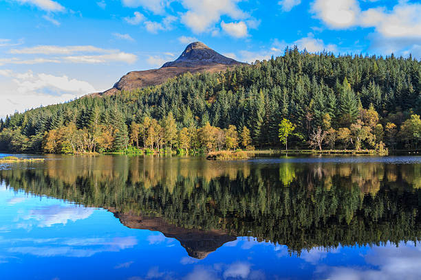 istock Autumn colour & pyramid-shape mountain reflected in lake 524153210