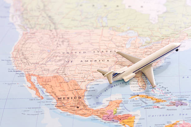istock Passenger airplane miniature on a map taking off from USA 524153656