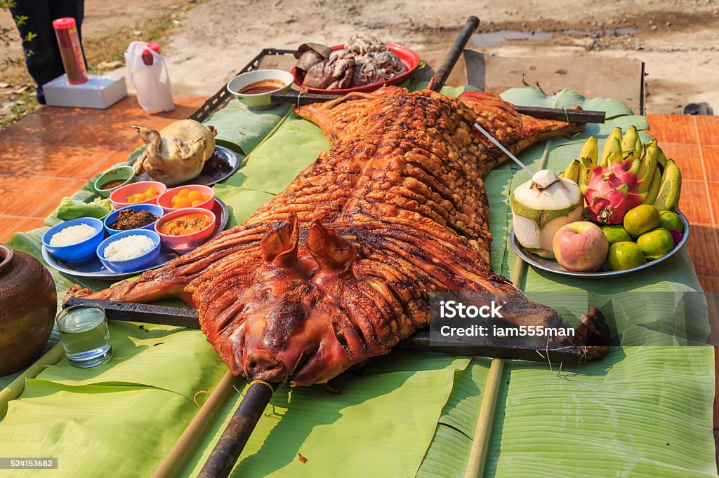 crispy grilled suckling pig on banana leaves Animal Stock Photo