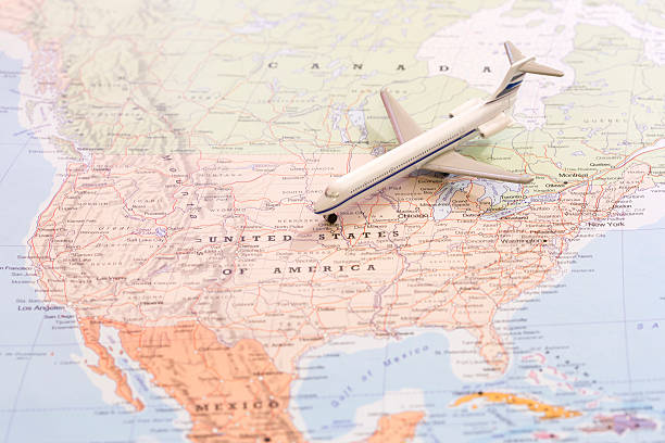istock Travel destination USA. Passenger airplane miniature on a map 524153812