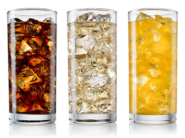 Glass of cola, fanta, sprite isolated. With clipping path Glass of cola, fanta, sprite with ice cubes isolated on white. With clipping path non alcoholic beverage stock pictures, royalty-free photos & images