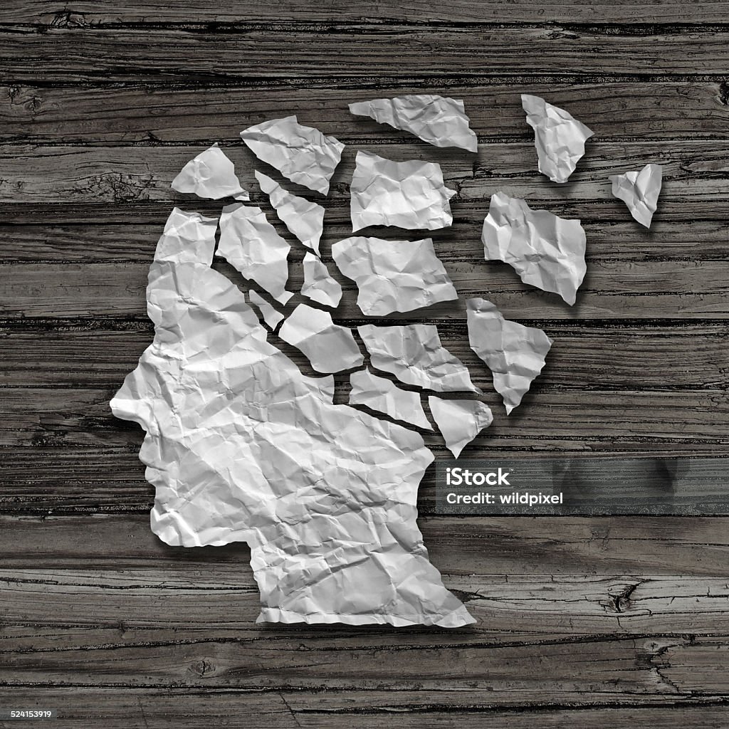 Alzheimer Patient Alzheimer patient medical mental health care concept as a sheet of torn crumpled white paper shaped as a side profile of a human face on an old grungy wood background as a symbol for neurology and dementia issues or memory loss. Deterioration Stock Photo
