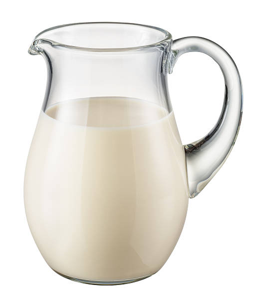 istock Glass pitcher of milk isolated on white. With clipping path 524154113