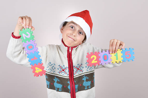 istock Young boy holding a 2014 and 2015 sign 524154153