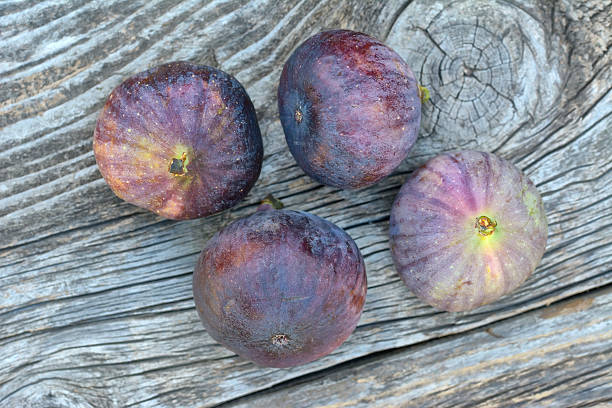 istock Fresh fig fruits on wooden table 524155857