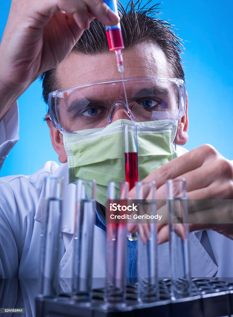 Laboratory equipment,  Man in the lab experimenting Adult Stock Photo