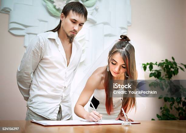 Newlyweds Undersign In The Registry Office Stock Photo - Download Image Now - Adult, Adults Only, Beautiful People