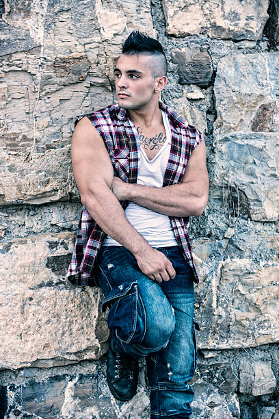 istock Handsome, muscular young man against rocks 524157164