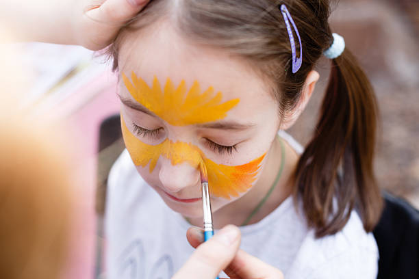 istock Child painting process at girl's face 524158244