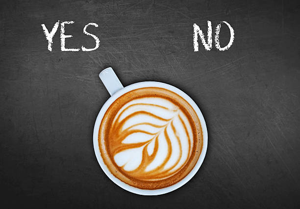 istock Cup of coffee on black board switching yes 524159000