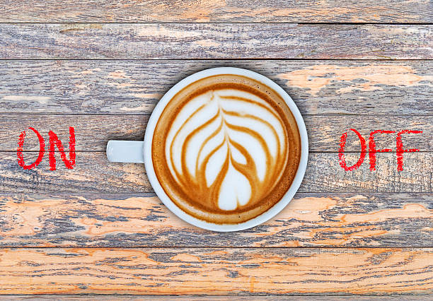 istock Cup of coffee on wooden board switching on 524159384