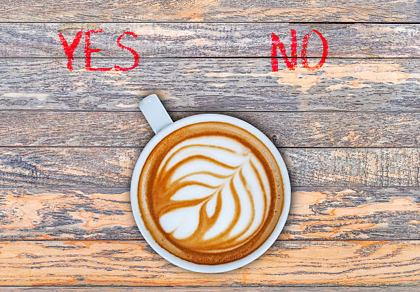 istock Cup of coffee on wooden board switching yes 524159538