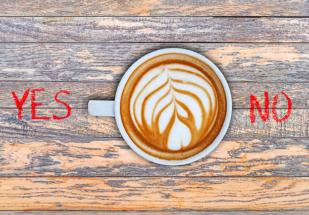 istock Cup of coffee on wooden board switching yes 524159696