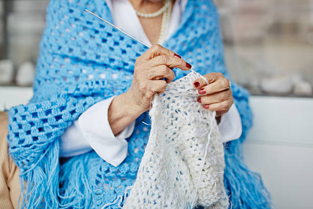 istock Mature woman knitting 524159996
