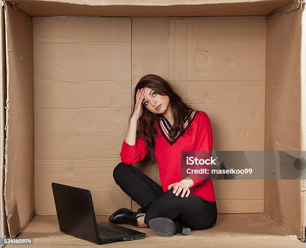 Depressed Business Woman Sitting In The Office Stock Photo - Download Image Now - Box - Container, Sitting, Uncomfortable