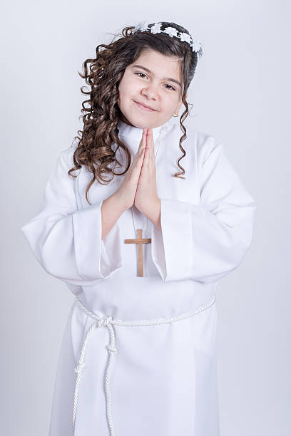 istock Little girl posing for the first communion 524161200