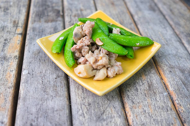 istock Stir fry sugar snap peas with pork 524161248