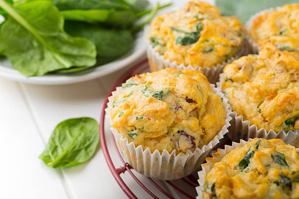 Muffins with spinach, sweet potatoes and cheese Muffins with spinach, sweet potatoes and cheese on white background. Healthy food concept. paleo diet stock pictures, royalty-free photos & images