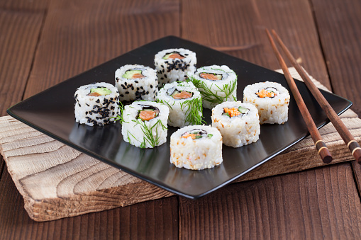 Uramaki sushi set on a plate. Shallow dof