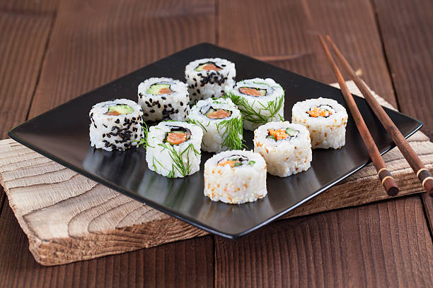 Uramaki sushi set Uramaki sushi set on a plate. Shallow dof ura maki stock pictures, royalty-free photos & images