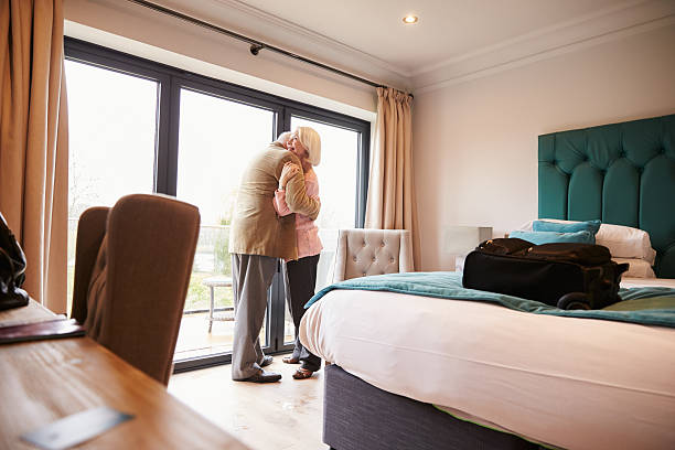 istock Senior Couple Arriving In Hotel Room On Vacation 524162736