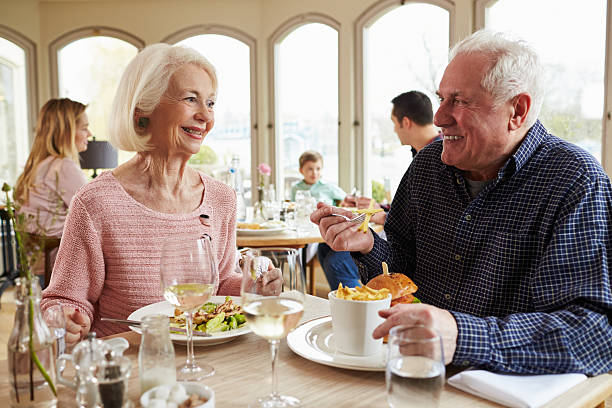 istock Senior Couple Enjoying Meal In Restaurant Together 524162902