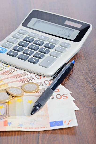 istock Calculator and money on the table 524164312