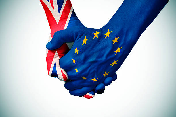 istock hands patterned with the British and the European flag 524164332