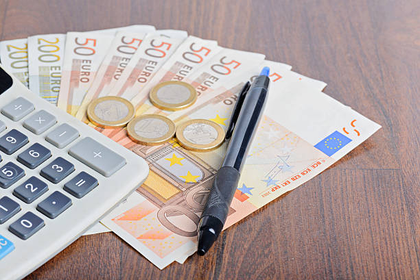 istock Calculator and money on the table 524164412