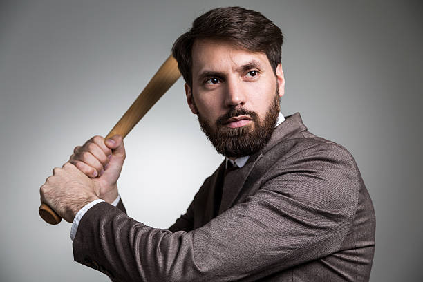 istock Businessman about to hit bat 524165440
