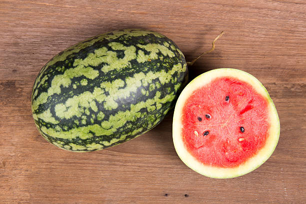 istock Tasty watermelon on brown wooden background 524166774