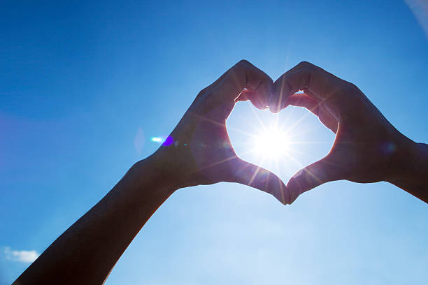 istock The blue sky, the sun and hand 524168040