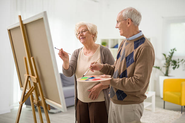 istock Elderly couple painting on a canvas 524168284