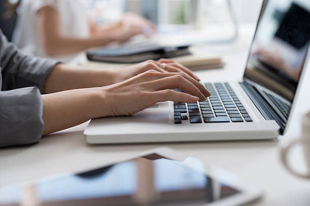 Women who are using a laptop in the office
