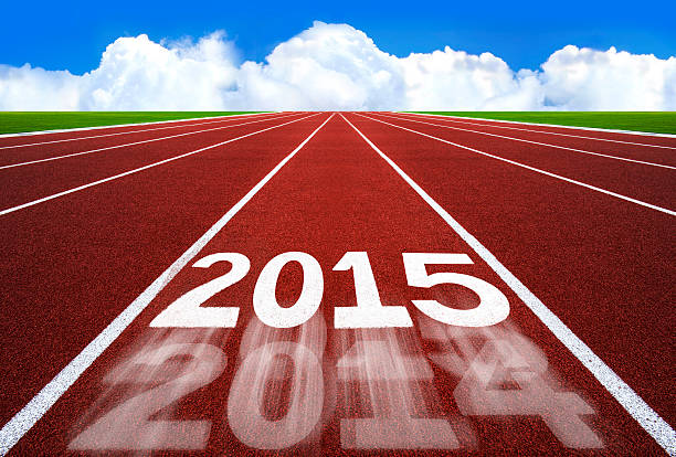 istock New Year 2015 on running track concept with blue sky. 524169547