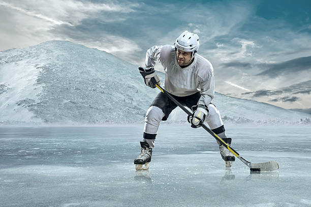 istock Ice hockey player on the ice in mountains 524169688