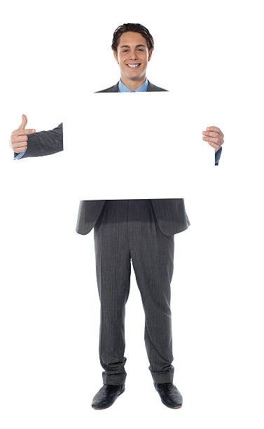 istock Business professional pointing towards an empty billboard 524170719