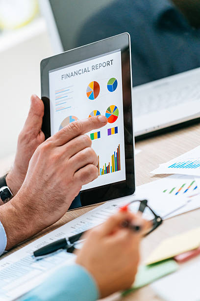 istock Teamwork with two business people in office with business analysis 524171358