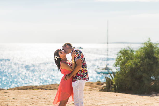 istock Romantic couple kissing on the beach 524171396