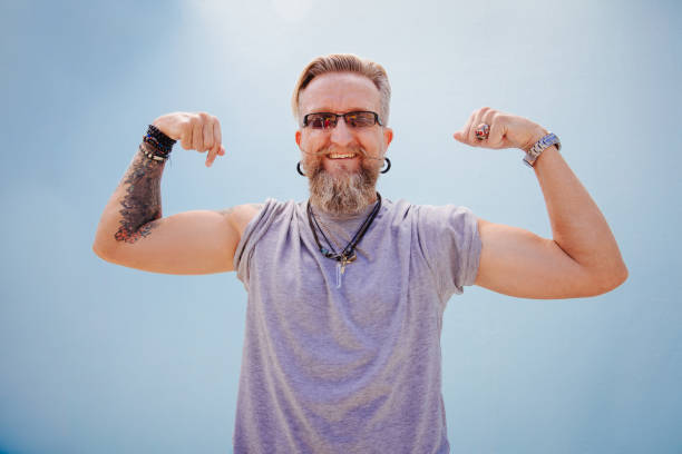 istock Athletic good looking mature man against blue wall 524171402