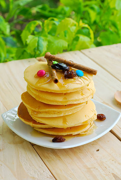 istock Stack of pancakes and syrup in plate on wooden table 524171651