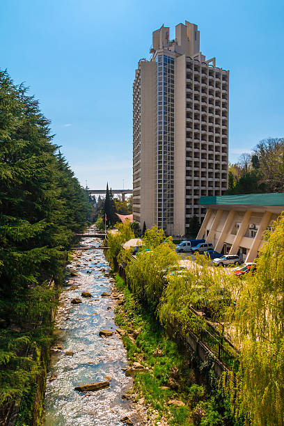 istock High-rise hotel on riverbank 524172438