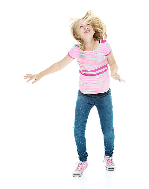 istock Happy little girl dancing 524173443