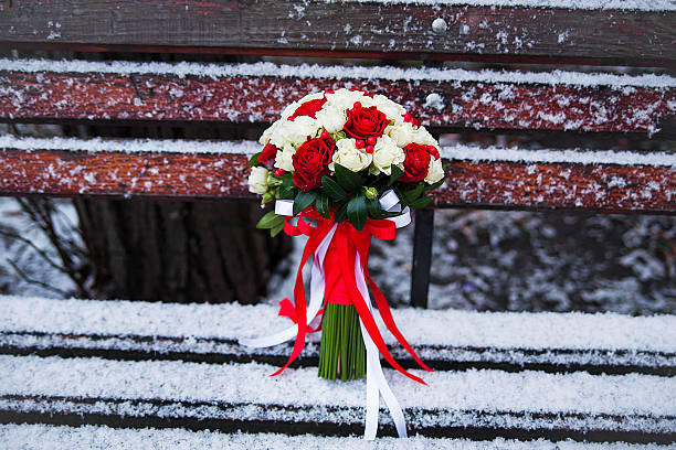 istock Wedding bouquet on a winter park bench 524173850