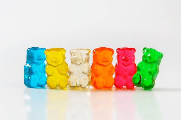 Gummy bears Fruit flavored gummy bears in assorted colors gummi bears stock pictures, royalty-free photos & images