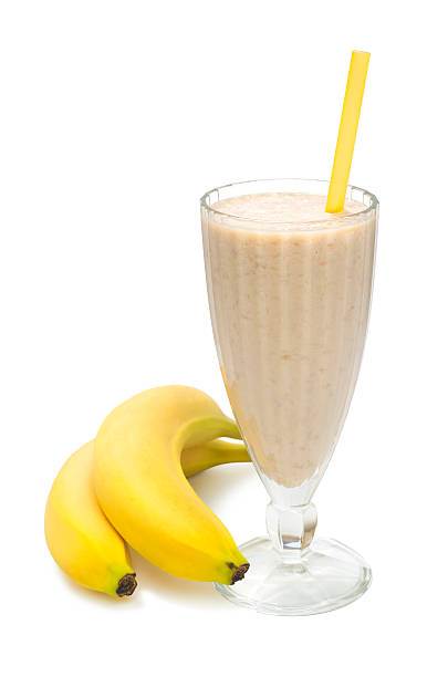 banana milk smoothie on white background stock photo