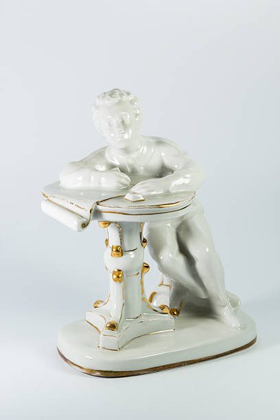 istock porcelain figurine of Pushkin on white background 524175436
