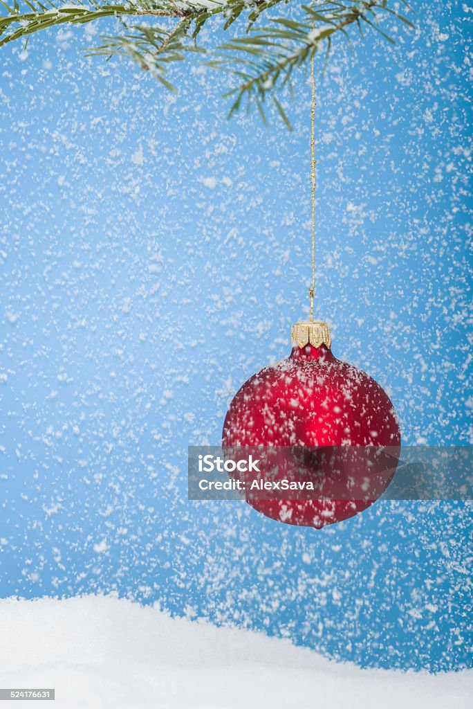 red christmas bauble red christmas bauble and snow Blue Stock Photo