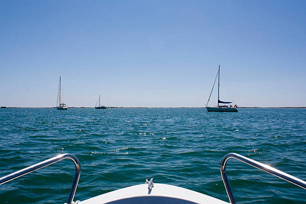 Typical mediterranean ship (llaut) floating in a quiet bay in the Mediterranean (Menorca). Spain.